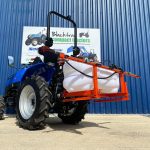 New Maple Spot & Broadcast Sprayer for Compact Tractor shown on the back of a Solis Compact Tractor
