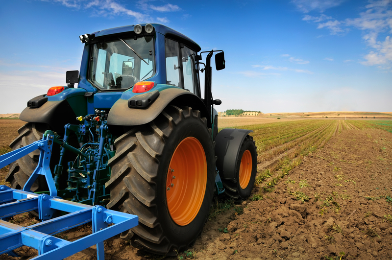 solis compact tractor on farm