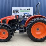 Side View Of Red Kubota M5111 Tractor