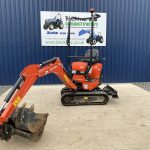 Front view of Kubota 008-3 Mini Digger with digger arm extended