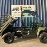 Side view of John Deere 855D Gator 4WD Diesel Utility Vehicle with back tipping