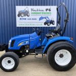 Side view of New Holland TC35DA HST Compact Tractor