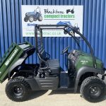Side view of Kawasaki SX Mule 4WD Utility Vehicle with back tipped