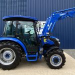 Side view of Solis 50 4WD Compact Tractor with Cab & Solis 5500V Loader & Bucket