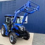 Front view of Solis 50 4WD Compact Tractor with Cab & Solis 5500V Loader & Bucket