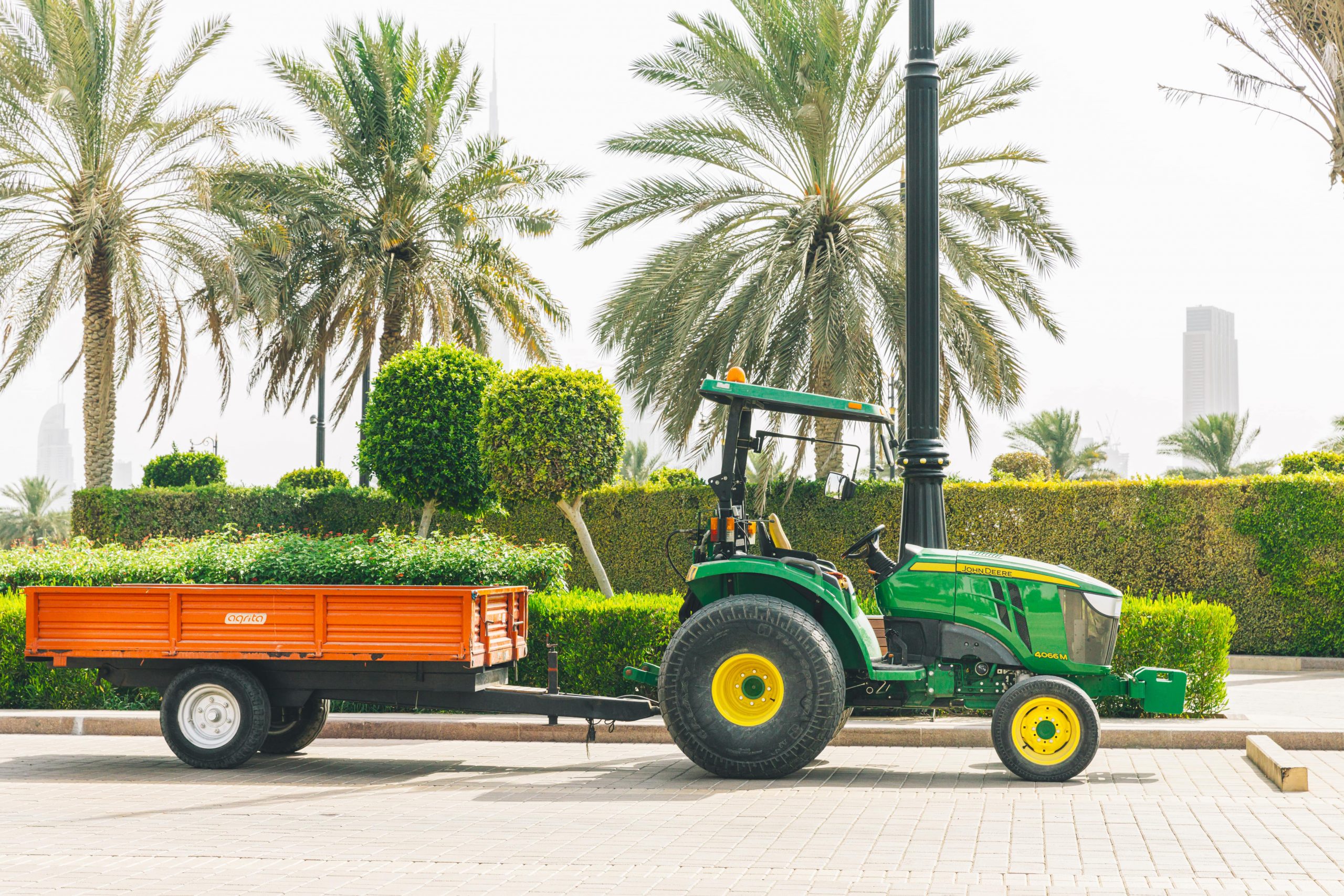 Johne Deere compact tractor with a trailer