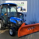 Front view of Solis 26HST Compact Tractor with Snowplough & Gritter