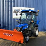 Front view of Solis 26HST Compact Tractor with Snowplough & Gritter