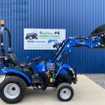 Side view of Solis 26HST Compact Tractor with 4:1 Bucket