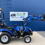 Side view of Solis 26HST Compact Tractor with 4:1 Bucket