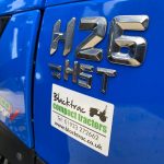 Close up of Solis 26HST Compact Tractor with 4:1 Bucket badge