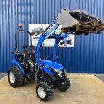 Front view of Solis 26S Compact Tractor with Loader, Hydraulic Grab & Pallet Forks (Loader lifted)