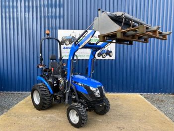 Front view of Solis 26S Compact Tractor with Loader, Hydraulic Grab & Pallet Forks (Loader lifted)