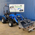 Front view of Solis 26S Compact Tractor with Loader, Hydraulic Grab & Pallet Forks (Loader lowered)