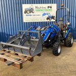 Front view of Solis 26S Compact Tractor with Loader, Hydraulic Grab & Pallet Forks (Loader lowered)
