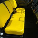 Close up inside cab of seats of John Deere XUV865M 4WD Gator