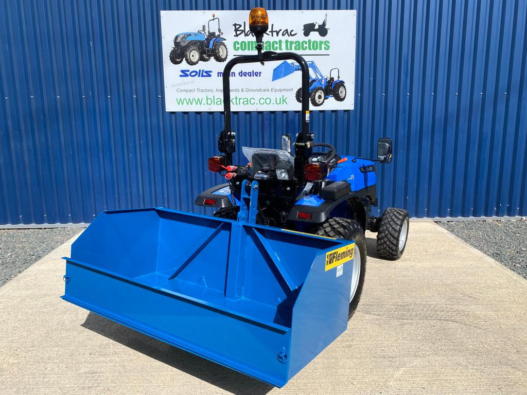 New Fleming 5ft Tipping Transport Box for Compact Tractor shown on the rear of a Solis 26 Compact Tractor