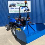 New Fleming 5ft Tipping Transport Box for Compact Tractor shown on the rear of a Solis 26 Compact Tractor