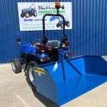 New Fleming 5ft Tipping Transport Box for Compact Tractor shown on the rear of a Solis 26 Compact Tractor