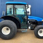 Side view of New Holland TN55D 4WD Tractor