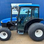 Side view of New Holland TN55D 4WD Tractor