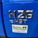 Close up of Solis 26HST Compact Tractor badge