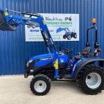 Side view of used Solis 20 Compact Tractor with Front Loader & Bucket showing loader raised