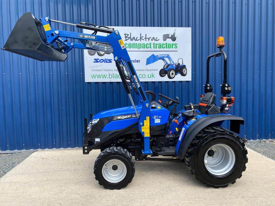 Side view of used Solis 20 Compact Tractor with Front Loader & Bucket showing loader raised