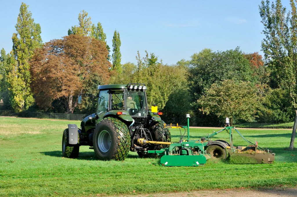 Tractor with grass cutting equipment used for landscaping
