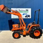 Side view of Kubota B8200 4WD Compact Tractor with Front Loader with Loader lifted