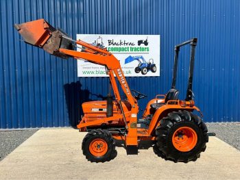 Side view of Kubota B8200 4WD Compact Tractor with Front Loader with Loader lifted