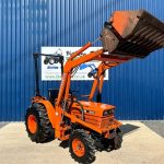 Front view of Kubota B8200 4WD Compact Tractor with Front Loader with loader lifted