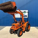 Front view of Kubota B8200 4WD Compact Tractor with Front Loader with loader lifted
