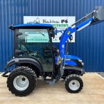 Side view of Solis 26HST Compact Tractor with Cab, Loader & Bucket with loader raised