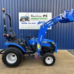 Side view of Solis 26HST Compact Tractor with Loader and Hydraulic Grab Bucket