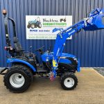 Side view of Solis 26HST Compact Tractor with Loader and Hydraulic Grab Bucket