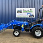 Side view of Solis 26HST Compact Tractor with Loader and Hydraulic Grab Bucket