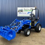 Front view of Solis 26HST Compact Tractor with Loader and Hydraulic Grab Bucket