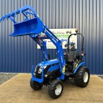 Front view of Solis 26HST Compact Tractor with Loader and Hydraulic Grab Bucket