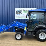 Side view of new Solis 26HST (Hydrostatic) Compact Tractor with Cab, Loader & Grab Bucket with loader lowered