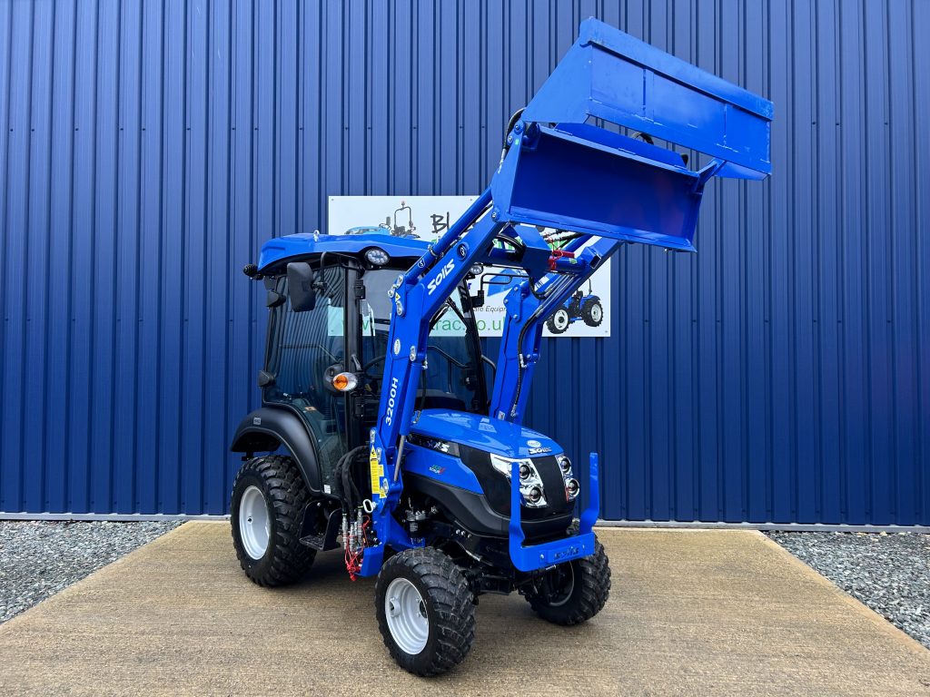 Front view of new Solis 26HST (Hydrostatic) Compact Tractor with Cab, Loader & 4:1 Bucket with loader raised and bucket open