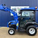 Side view of new Solis 26HST (Hydrostatic) Compact Tractor with Cab, Loader & 4:1 Bucket with loader raised