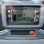 Close up of hour clock of the Massey Ferguson 1740M 4WD Compact Tractor