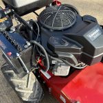 View of engine and battery of Toro Mid-Size 36" Pedestrian Commercial Flail Mower