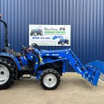 Side view of new Solis 40 Shuttle 4WD Compact Tractor with Front Loader, bucket open